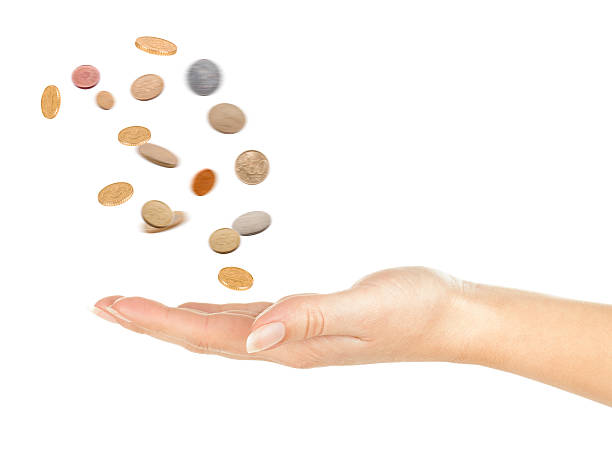 istock coins fall out of the hand 525384129