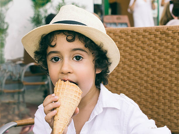istock Cute little Boy Eating Ice-Cream 525384687
