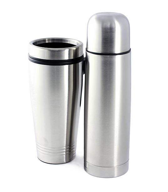 istock Thermos and a mug for hot liquids 525385075