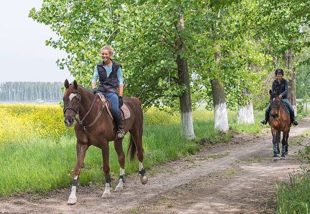 istock Girls on horseback riding 525386007