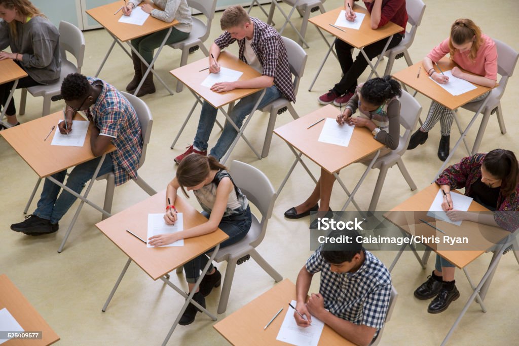 Elevated view of students writing their GCSE exam  Educational Exam Stock Photo