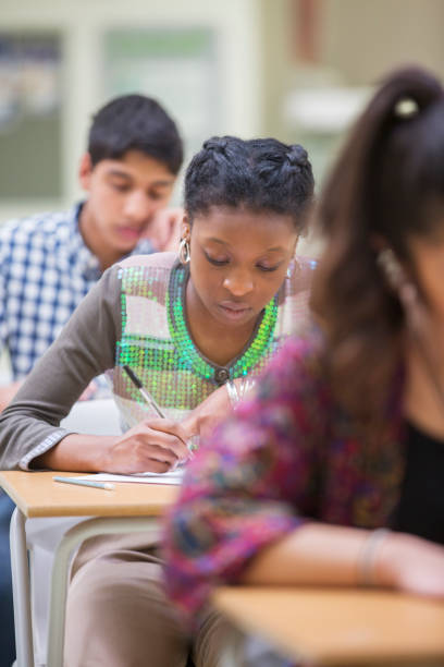 istock Students writing their GCSE exam in classroom 525409741