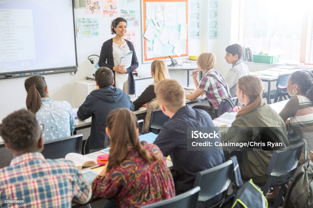 Teacher and students in classroom during lesson  Classroom Stock Photo