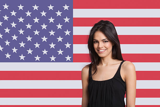 istock Young woman in front of flag 525415929
