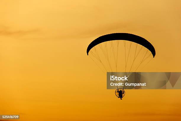 Paramotor Paraglider Flying Into Sunset Sky Stock Photo - Download Image Now - Abstract, Activity, Adult