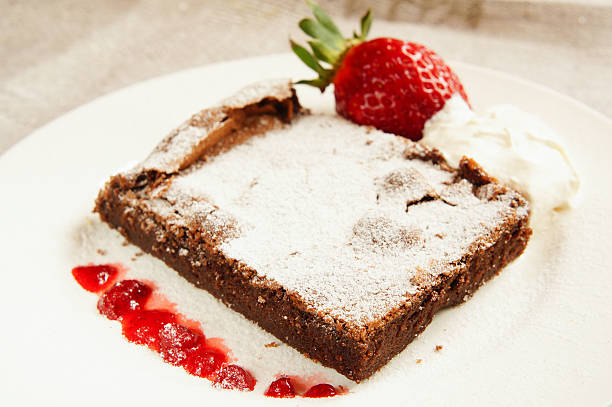 istock chocolate cake with strawberrry and whipped cream 525417765