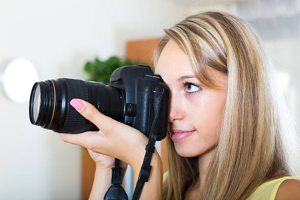 istock Camerawoman taking images indoor 525418287