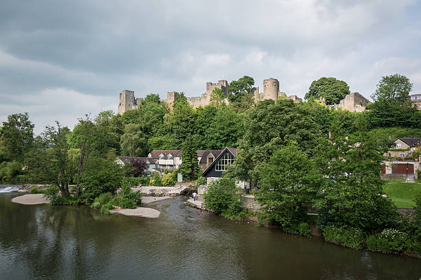 Ludlow castle and riverside Ludlow, UK - 19 June, 2014: Ludlow Castle and riverside. ludlow shropshire stock pictures, royalty-free photos & images
