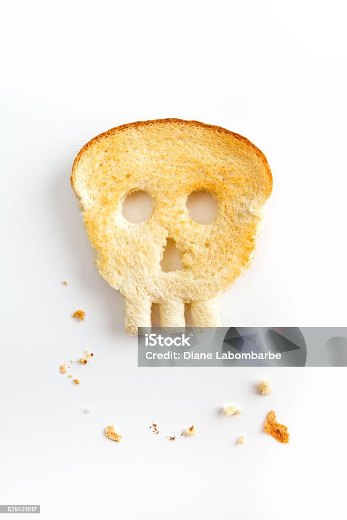 Toasted Bread Shaped Like Skull - Unhealthy Gluten Concept Bread Stock Photo