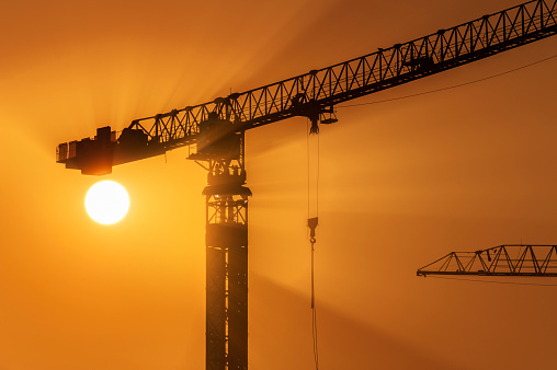 Crane in Construction site under sunset