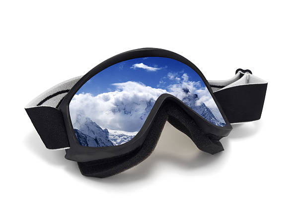 istock Ski goggles with reflection of snowy mountains 525422797