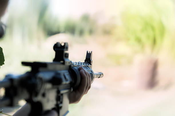 shooter sighting in the target. stock photo