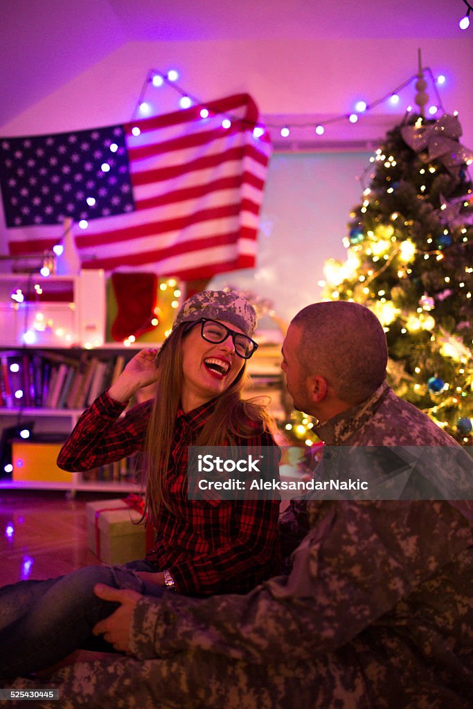 Home for Christmas US soldier spending Christmas holidays at home, spending time with his girl Christmas Stock Photo