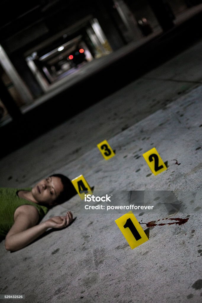 Dead Body at Crime Scene Dead body and blood splatter marked at a crime scene. Women Stock Photo