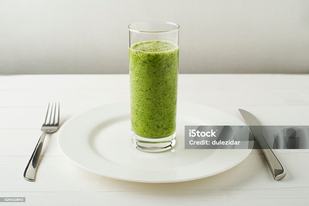 Smoothie Glass of Healthy green smoothie with vegetables Basil Stock Photo