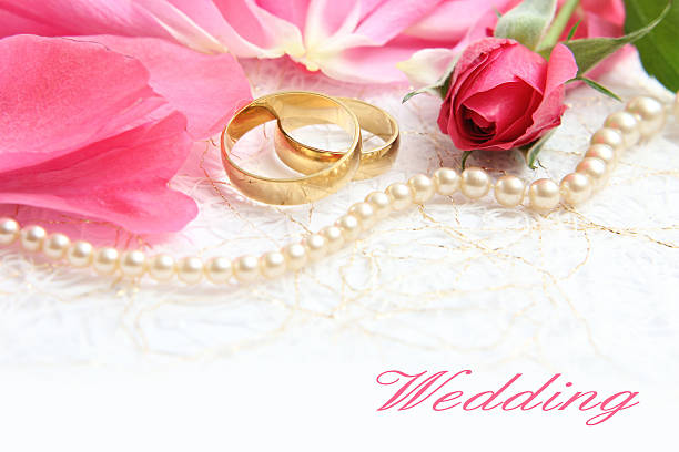istock pair of wedding rings with roses for background image 525432891