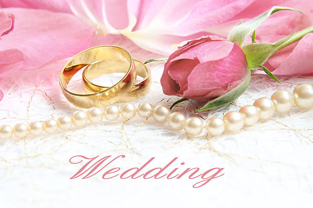 istock pair of wedding rings with roses for background image 525432893