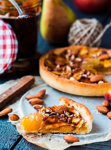 istock apple tart on a sand base with caramel on parchment 525433733