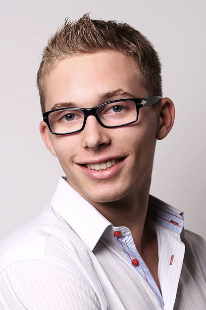 istock young man in glasses smiling 525434579