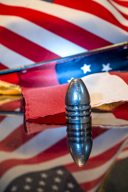 istock Civil War Bullet with Flag Background 525434893
