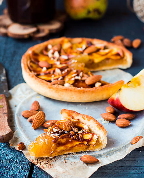 istock apple tart on a sand base with caramel on parchment 525436663