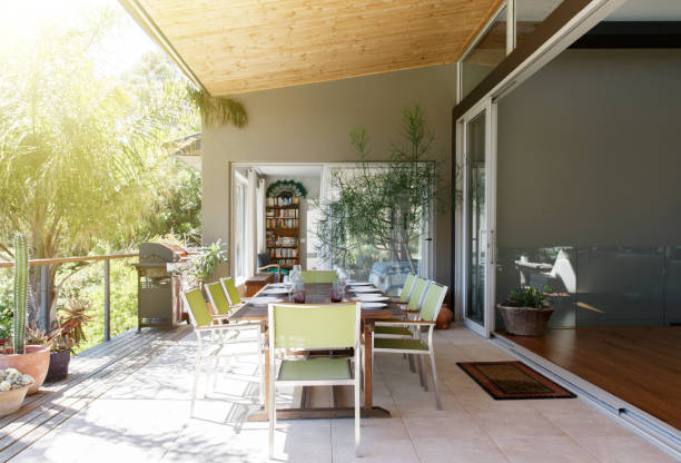istock Dinning table and chairs in sunny patio 525439925