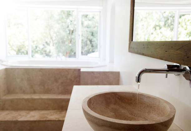 istock Modern bathroom interior with stone sink and bathtub 525439933