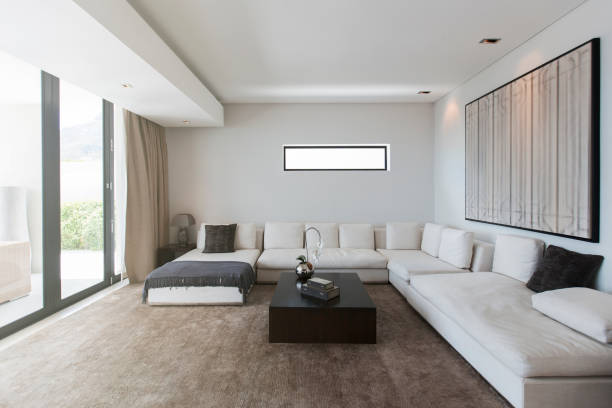 istock View of modern living room with sofas, coffee table and abstract painting 525440017