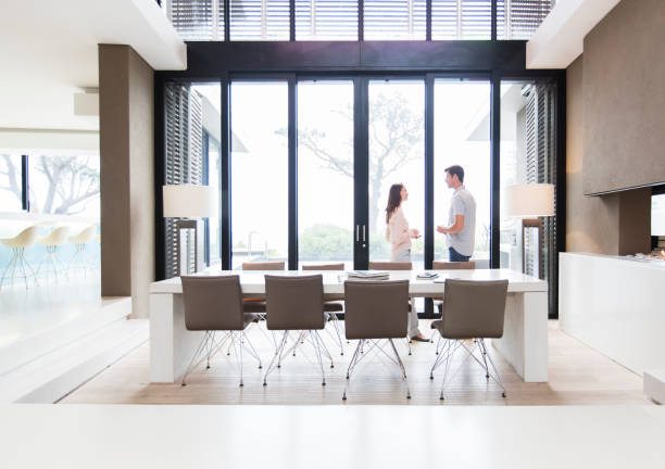 istock Couple talking in modern dining room 525440131