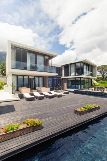 istock Modern house with large deck and swimming pool 525440179