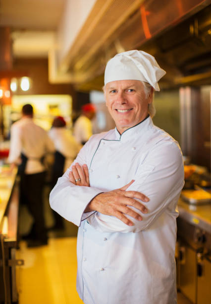 istock Portrait of smiling chef in restaurant kitchen 525441187