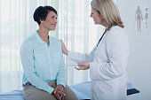 istock Smiling female doctor talking to patient in office 525441323