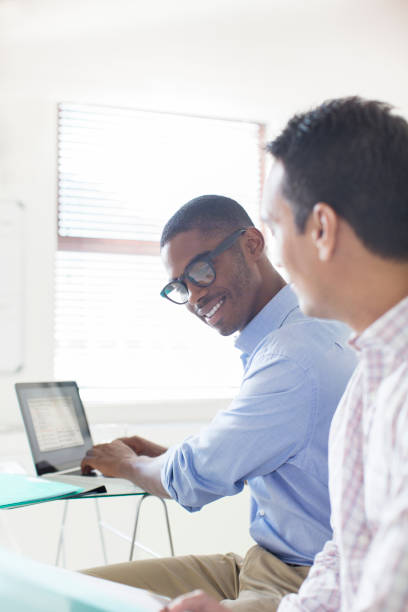 istock Businessmen working with laptop in office 525441431