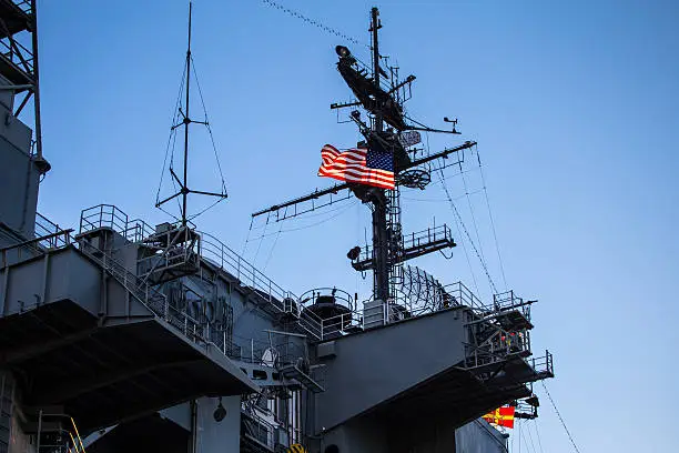 Photo of US military aircraft carrier tower and control bridge