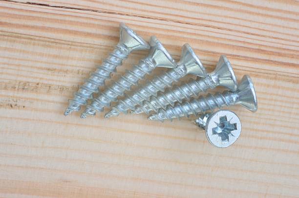 istock Group of screws with wood in close up 525452017