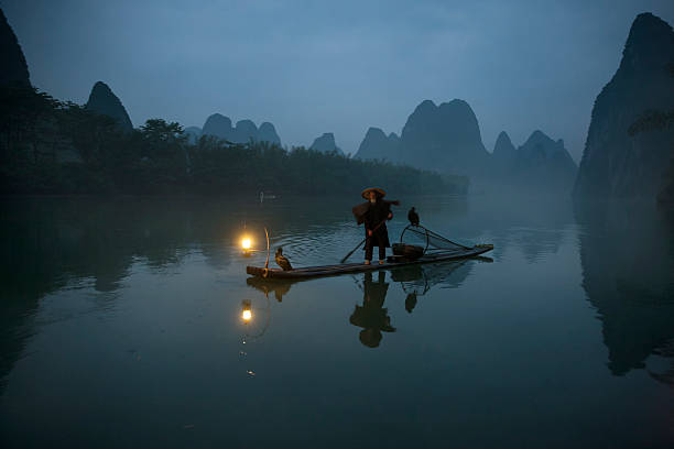 istock Cormorant fisherman of river Lee 525453211