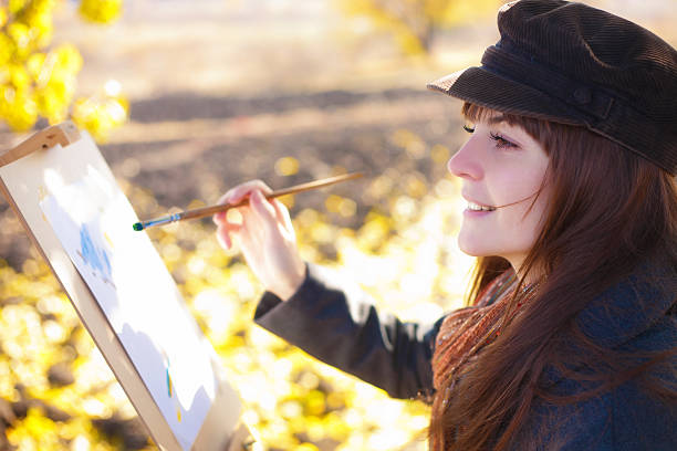 istock The girl draws on nature autumn 525453459