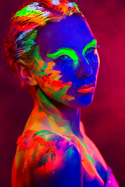 istock Woman Portrait painted with UV makeup color 525454287