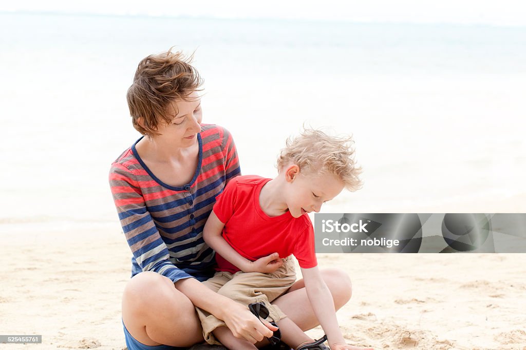 family vacation happy mother and son enjoying time together at the beach Adult Stock Photo