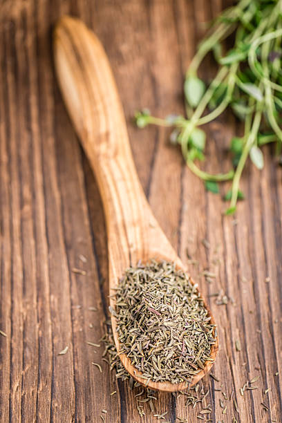 istock Dried Thyme on wooden background 525471334