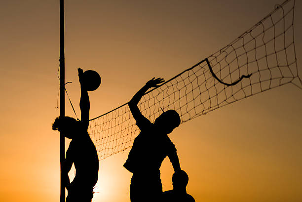 istock Volleyball playing people silhouettes 525471756