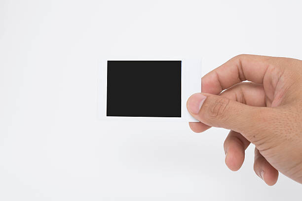 istock Hand holding instant film 525475646