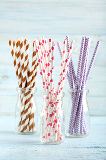 istock Drink straws on a blue wooden background 525476102