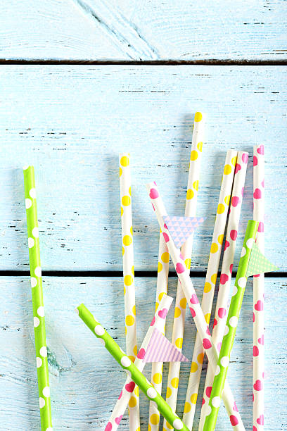 istock Drink straws on a blue wooden background 525476372