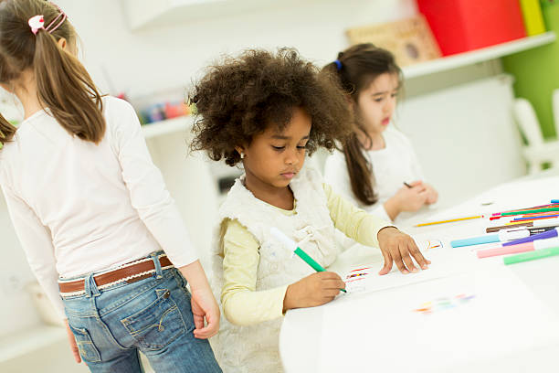 istock Multiracial children drawing in the playroom 525479190
