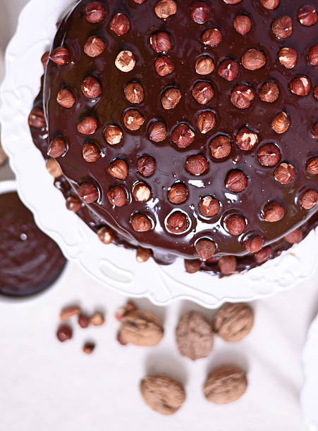 istock Delicious chocolate cakes with hazelnut on table close-up 525481944