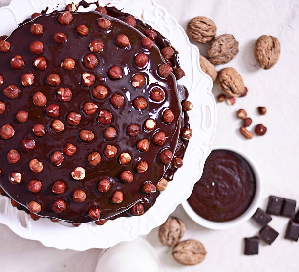 istock Delicious chocolate cakes with hazelnut on table close-up 525481990