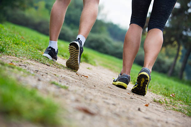 istock Young people running in the park 525483024