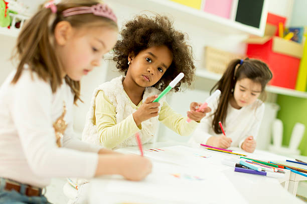 istock Multiracial children drawing in the playroom 525483776