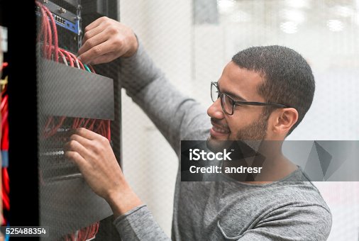 istock IT technician fixing a server at the office 525488354